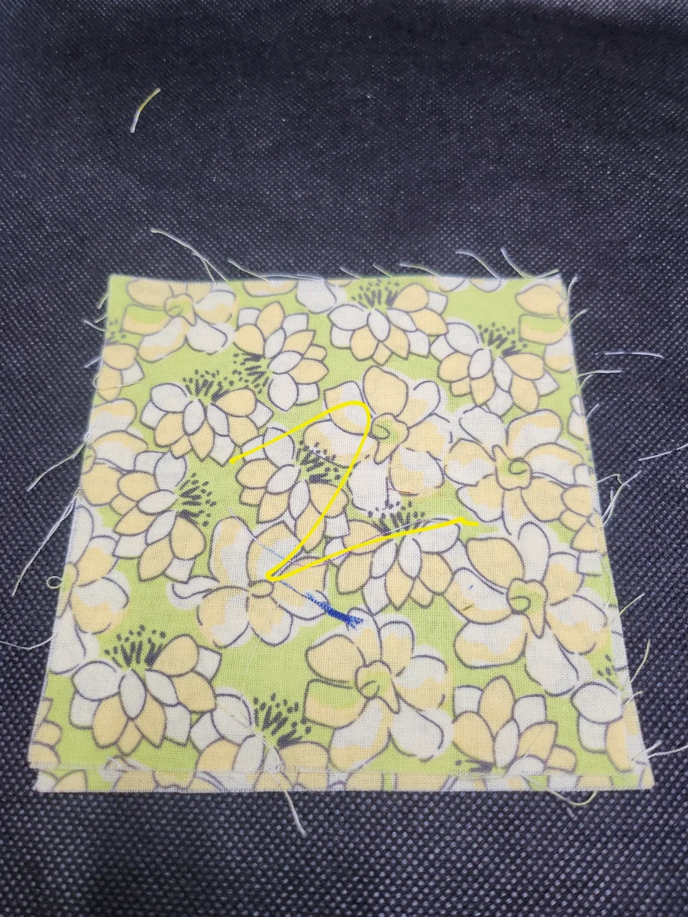 Two 4.50 inch precut cotton fabric squares